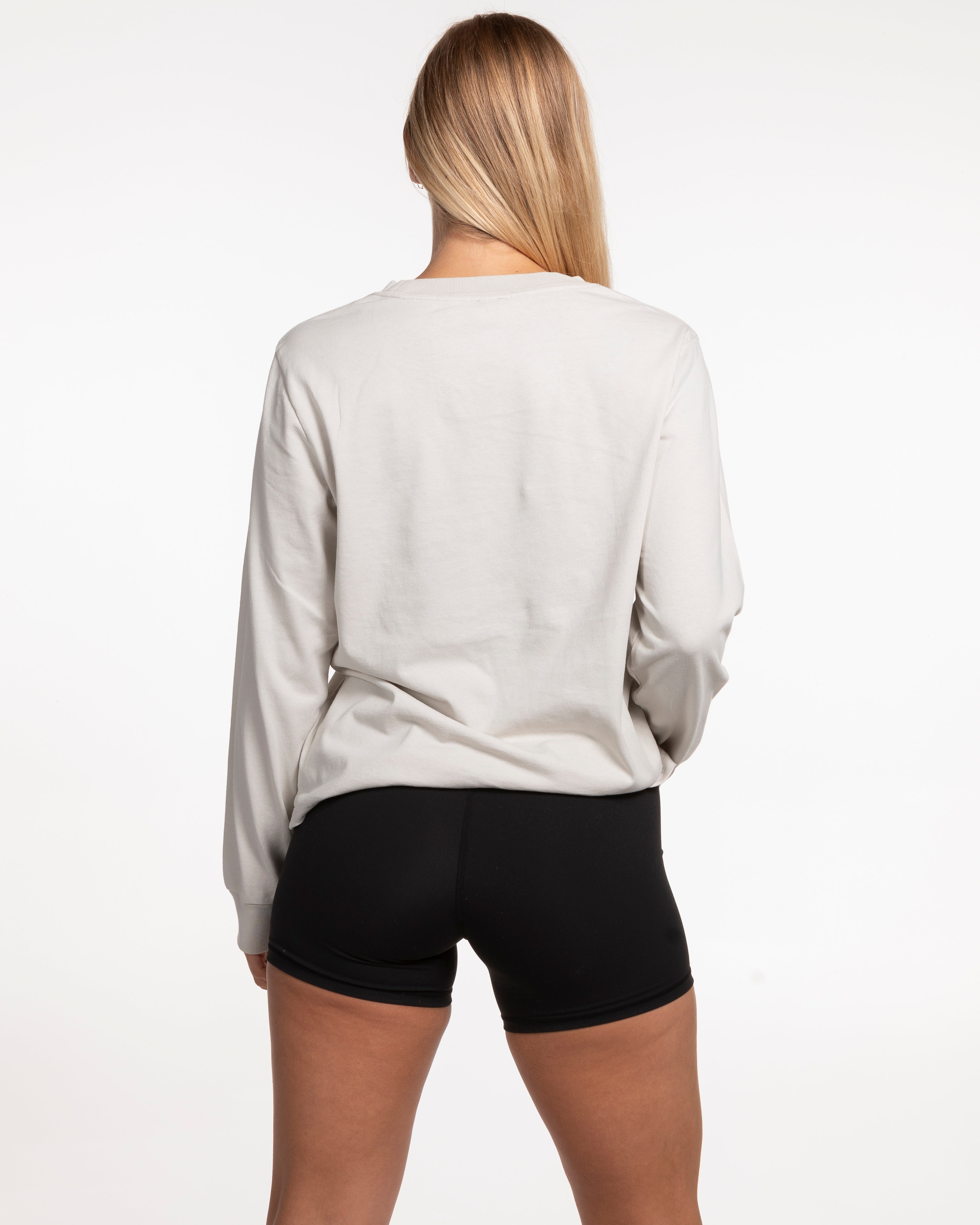 The Womens Heavyweight Long Sleeve - Washed Bone - Studio 11 - Left Chest & Back Center Stacked - Tone on Tone