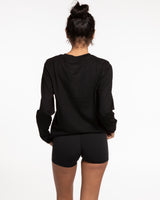 The Womens Long Sleeve - Black - Studio47 Pilates - Left Sleeve - Back Neckline - Printed - Black