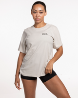 The Womens Heavyweight Tee - Washed Bone - Anthem Church - Left Chest Stacked & Back Neckline - Washed Gray