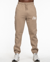 The Mens Classic Sweatpants - Sand - Ethos Q4 Photoshoot - Left Leg - Printed - Washed Bone