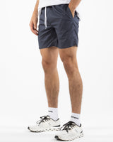 The Mens Beach Short - Petrol Blue - Rush Cycle Studio - Left Leg Stacked - Printed - Full Color