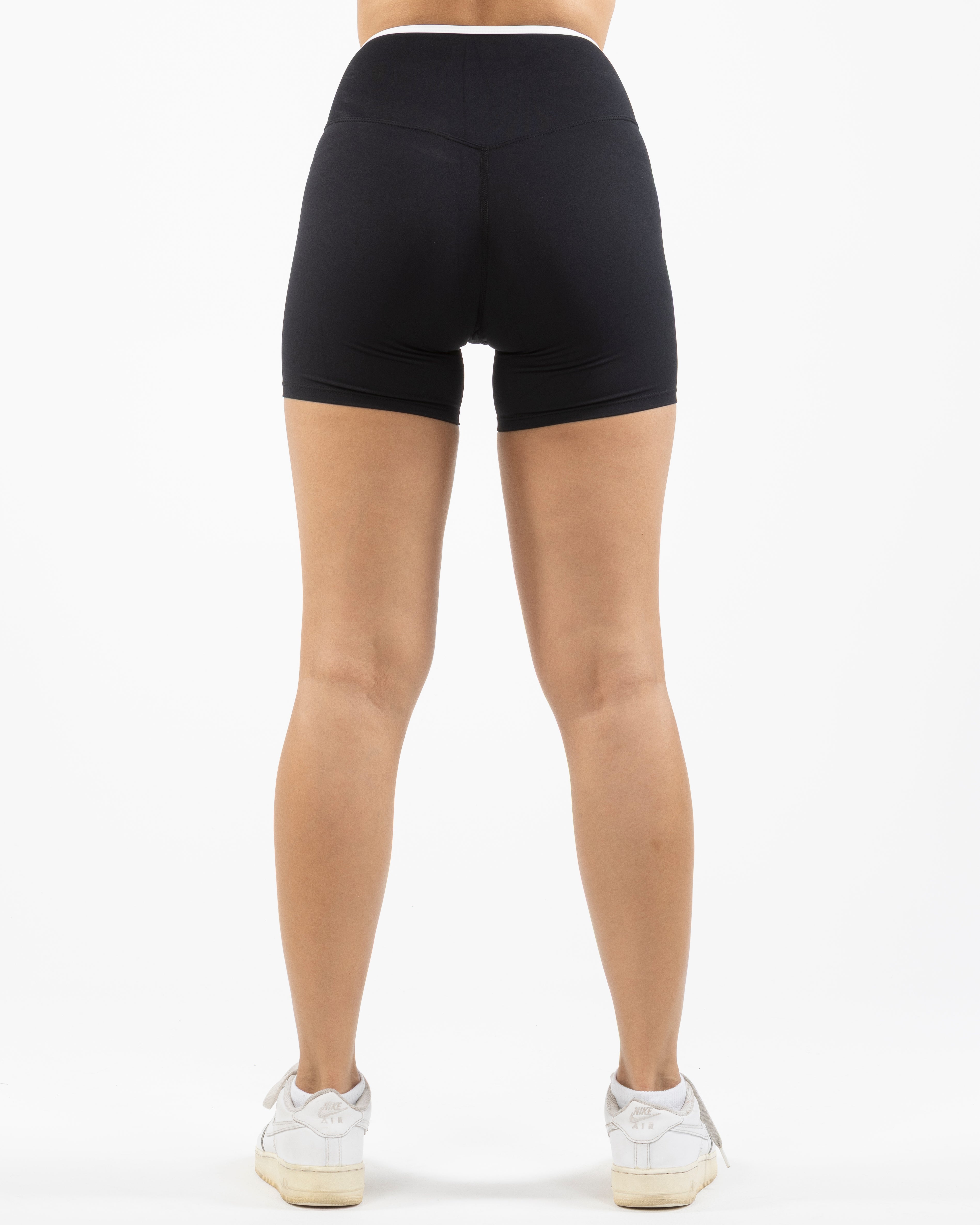 The Piped Crossover Short - Black - Summer 2026 - Front Bottom Left - Printed - White