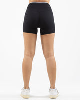 The Piped Crossover Short - Black - Summer 2026 - Front Bottom Left - Printed - White