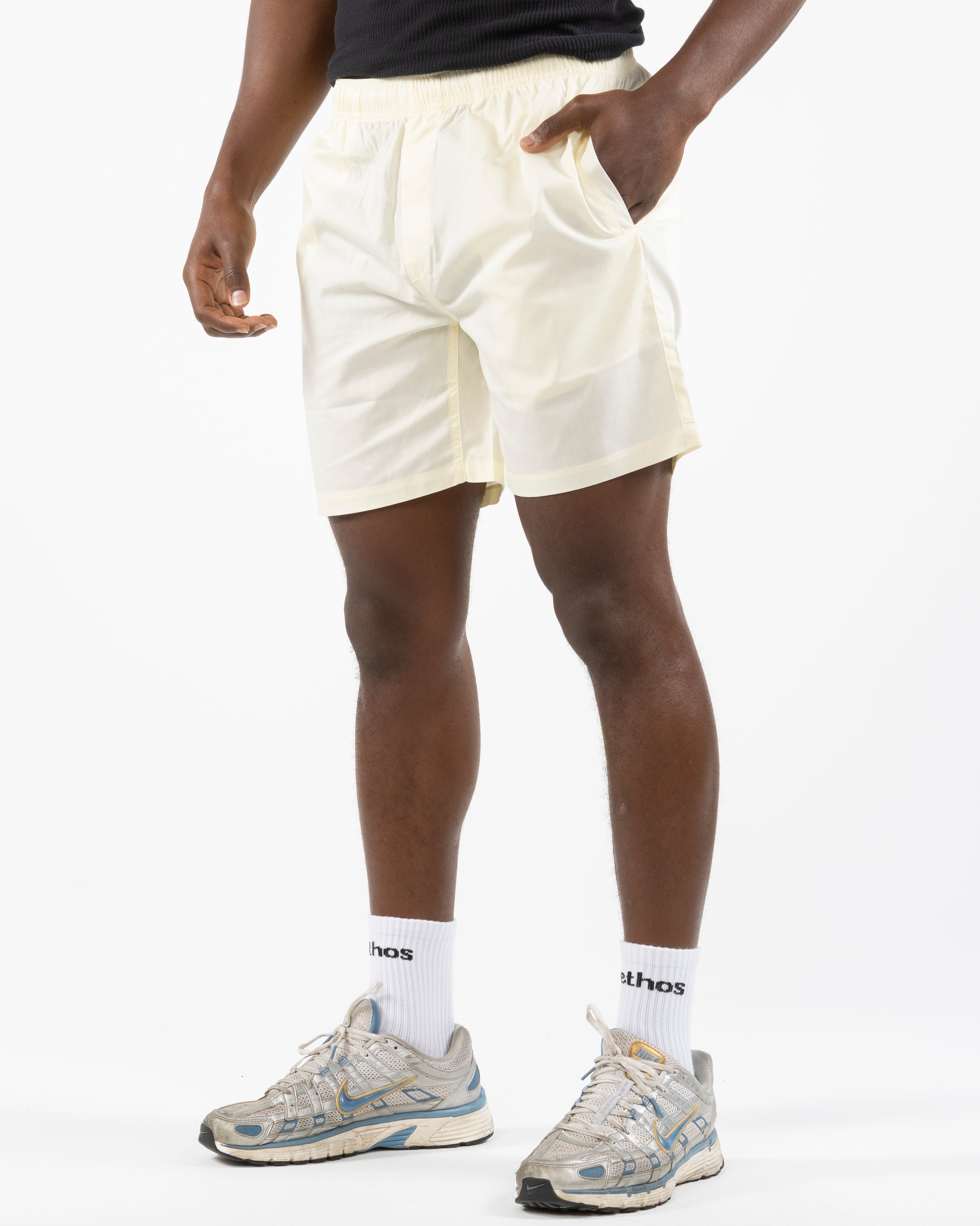 The Mens Beach Short - Butter - Rush Cycle Studio - Left Leg Stacked - Printed - Full Color