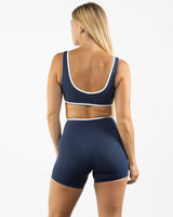 The Piped Bra - Navy - Pilates Plus PB - Left Chest - Printed - White