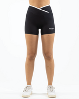 The Piped Crossover Short - Black - Summer 2026 - Front Bottom Left - Printed - White