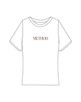 The Baby Tee - White - Method Pilates - Center Chest - Printed - Brown