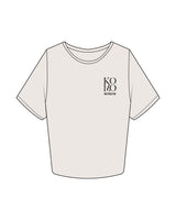 The Crop Tee - Bone - Komo Studio - Left Chest Stacked & Back Stacked - Printed - Charcoal