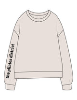 The Midweight Unisex Crewneck - Washed Ivory - THE PILATES DISTRICT - Right Sleeve - Printed - Black