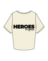 The Crop Tee - Butter - Heroes Fitness - Left Chest & Right Sleeve "TRAINER" - Back Stacked - Printed - Black