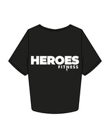 The Crop Tee - Black - Heroes Fitness - Left Chest & Right Sleeve "TRAINER" - Back Stacked - Printed - White